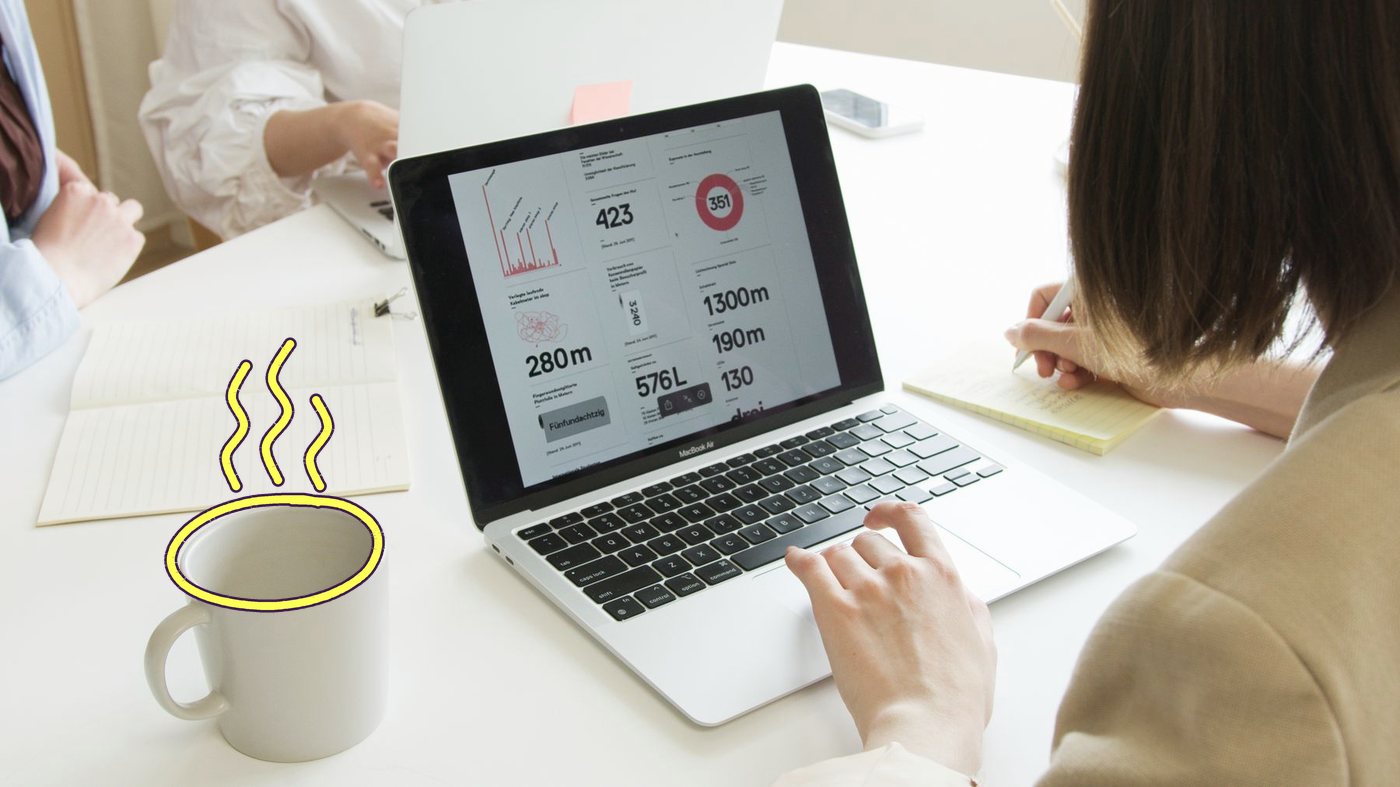 A marketer reading a results dashboard on her laptop