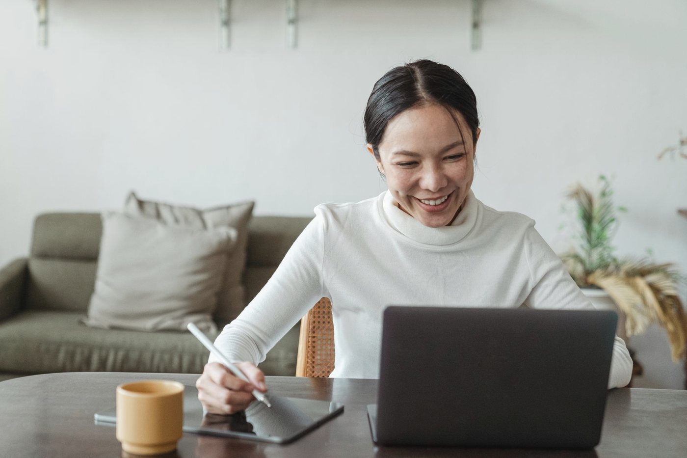 A technical owner working at her laptop