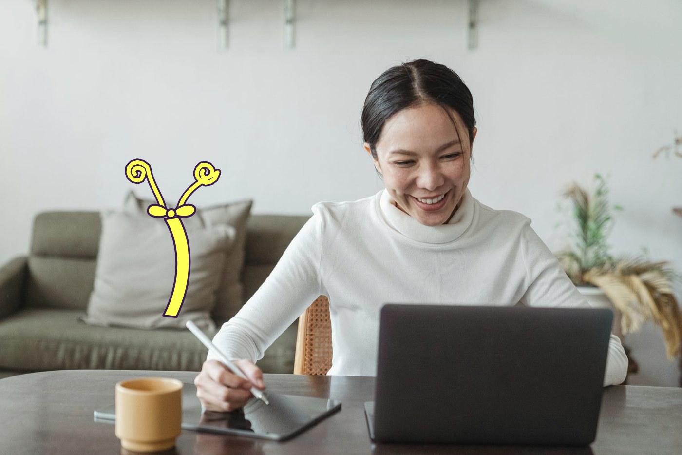 A technical owner at her laptop, a lemon ribbon drawn down the pillow behind her, tied with a bow, both ends curling up